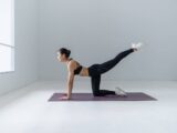 a woman doing yoga - GIBX Scam News